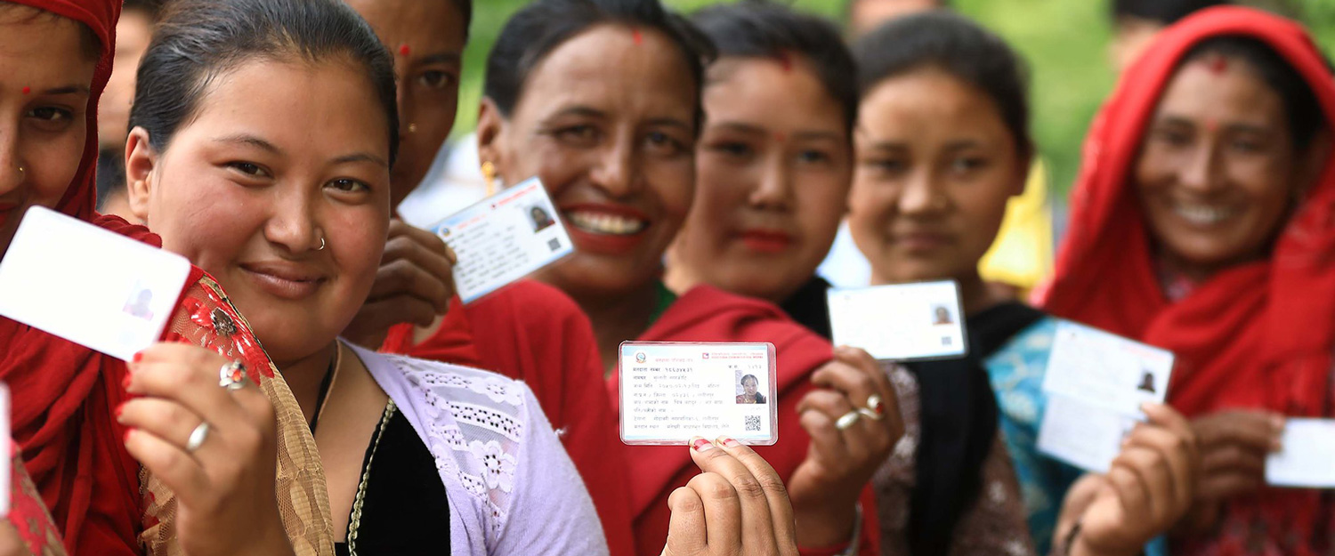 Women showing their IDs during elections in Lalitpur, Nepal.