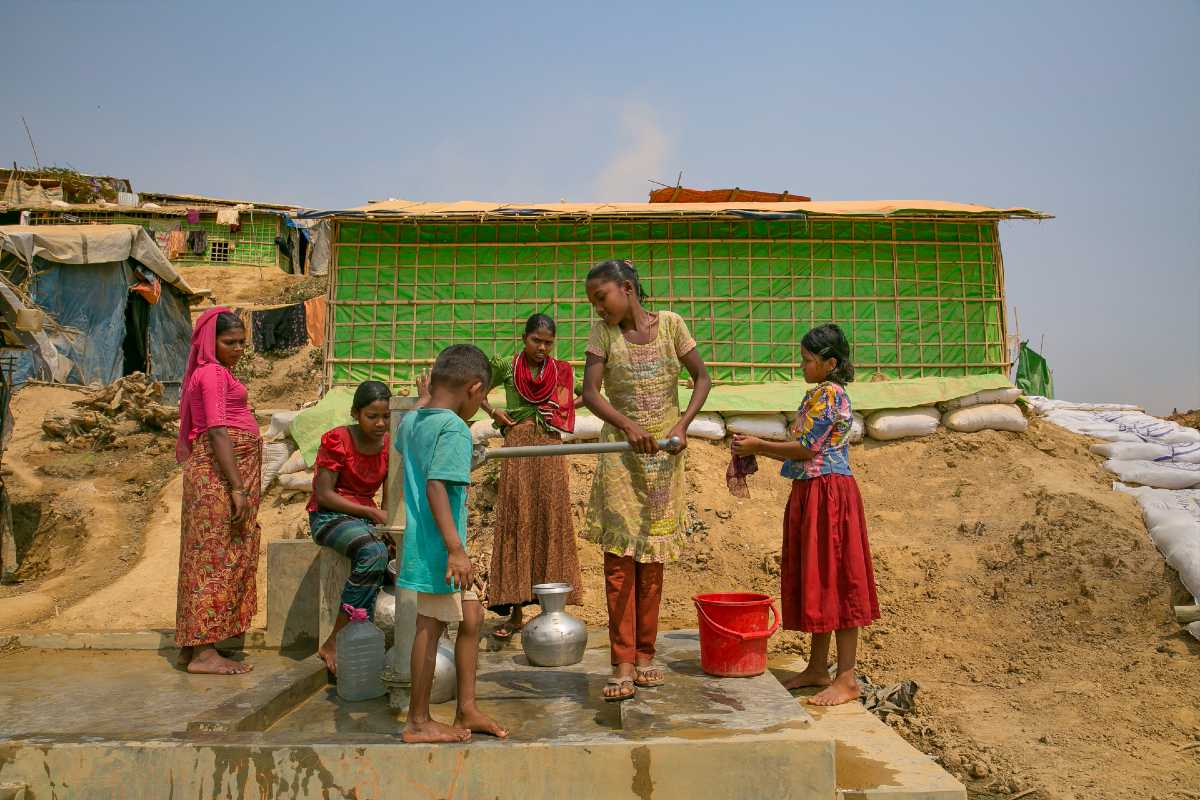 Girls pump water in Balukhali camp in Cox's Bazar, Bangladesh.