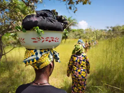 Women walk along a road