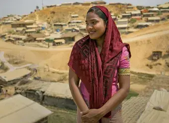 Senu Ara, 17, stands outside the Women's Centre in Balukhali camp March 6, 2018. She arrived in Cox’s Bazar the same way as many other Rohingya refugees: On foot. Photo: UN Women/Allison Joyce