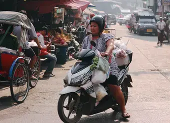 migrant worker ona motorbike