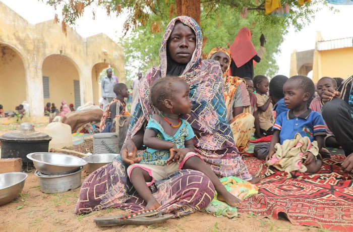 Mariam Djimé Adam, a refugee from Sudan with eight children, is seen in the yard of a secondary school in the neighbouring country of Chad.. 