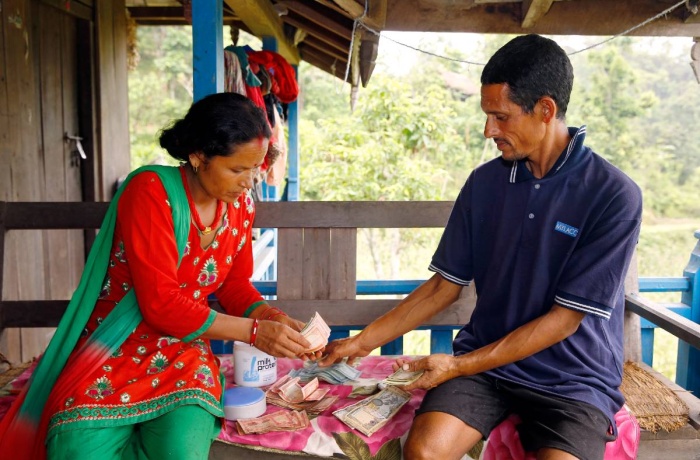 Chandra Kala Thapa along with her husband Bir Bahadur Thapa keep track of income from the sale of recently-harvested eggplant.