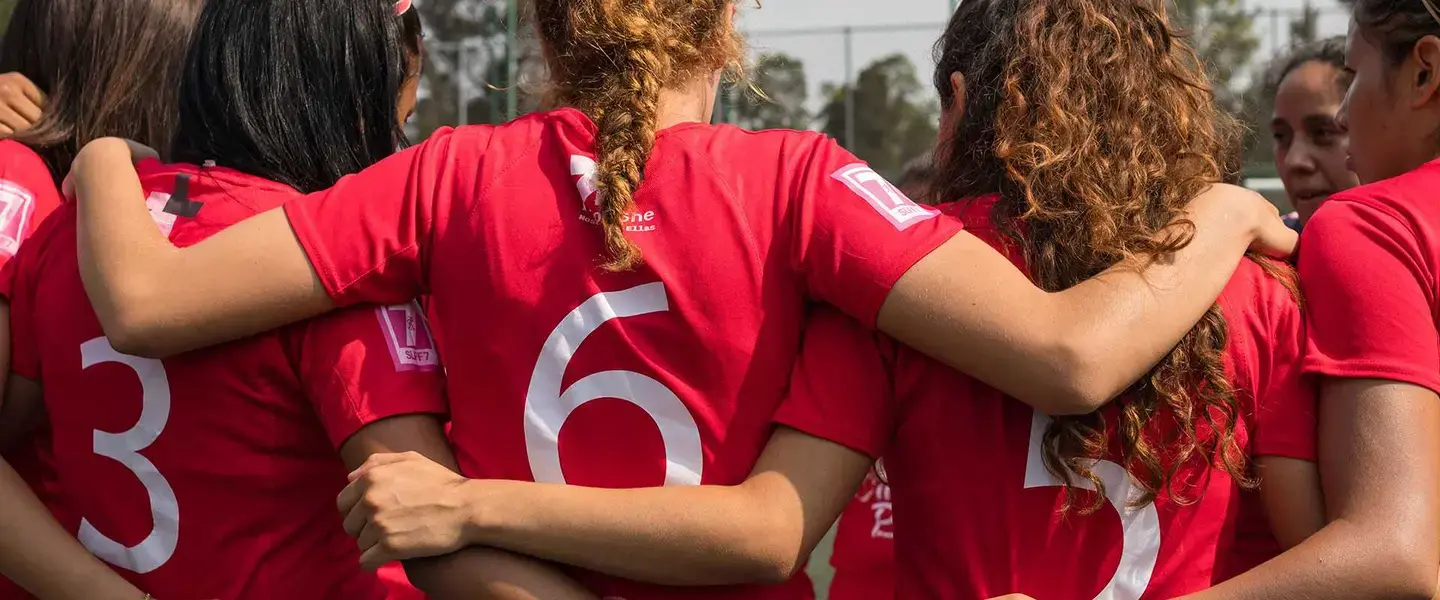 A group of girls huddle together before a football match in Mexico as part of the first HeForShe Lightning Tournament 