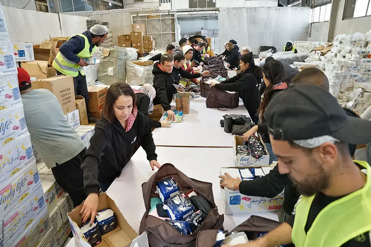 UN Women joins the Jordan Hashemite Charity Organization to pack thousands of dignity kits, including menstrual hygiene products to send to Gaza in February 2024. The war in Gaza has left Palestinian women and girls in devastation, without access to adequate food, water, sanitation, and hygiene, impacting their mental and physical well-being and dignity.
