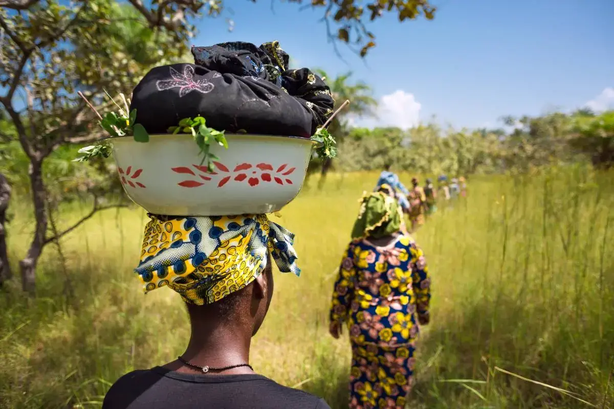 Women walk along a road